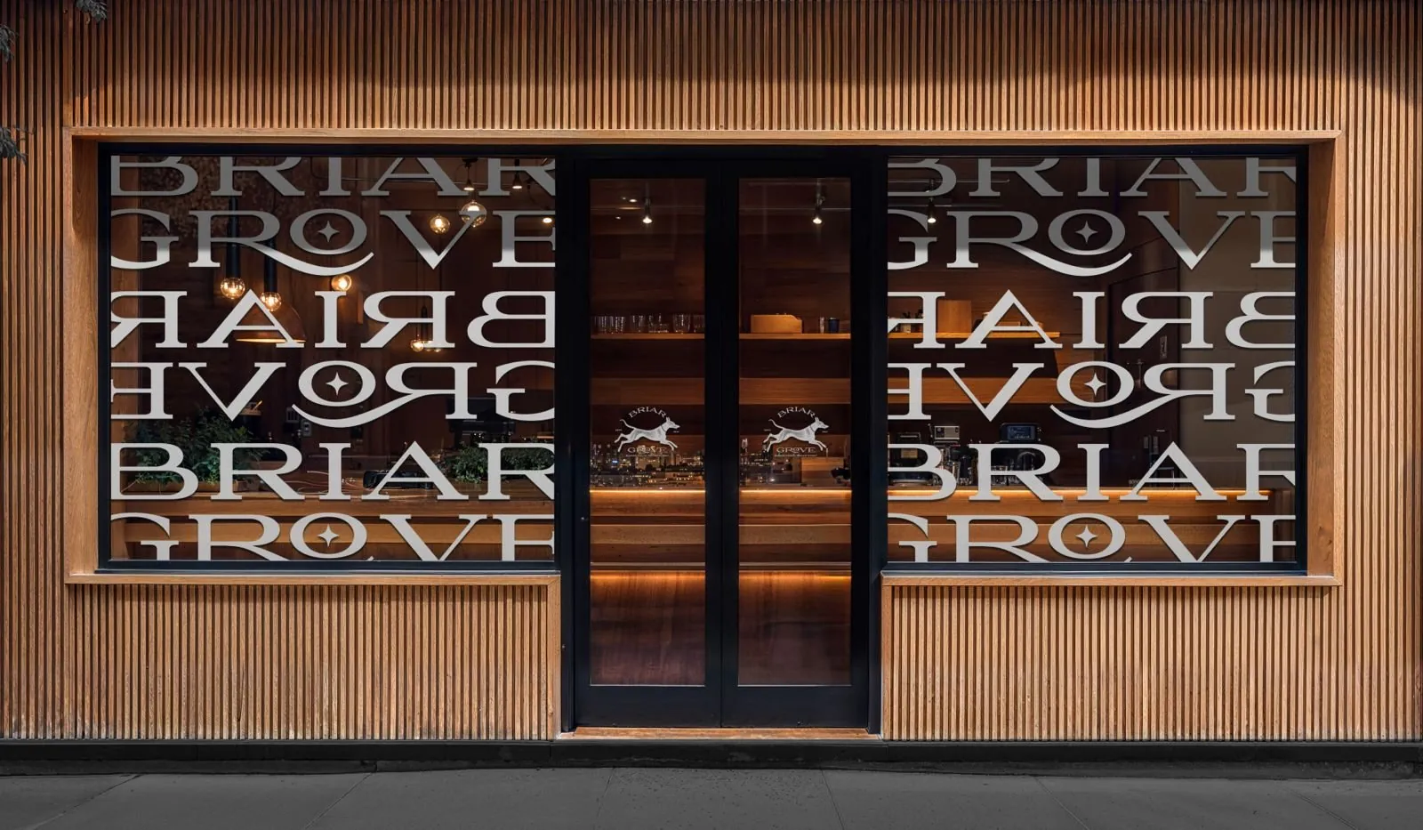 Briar Grove storefront with repeating wordmark windows
