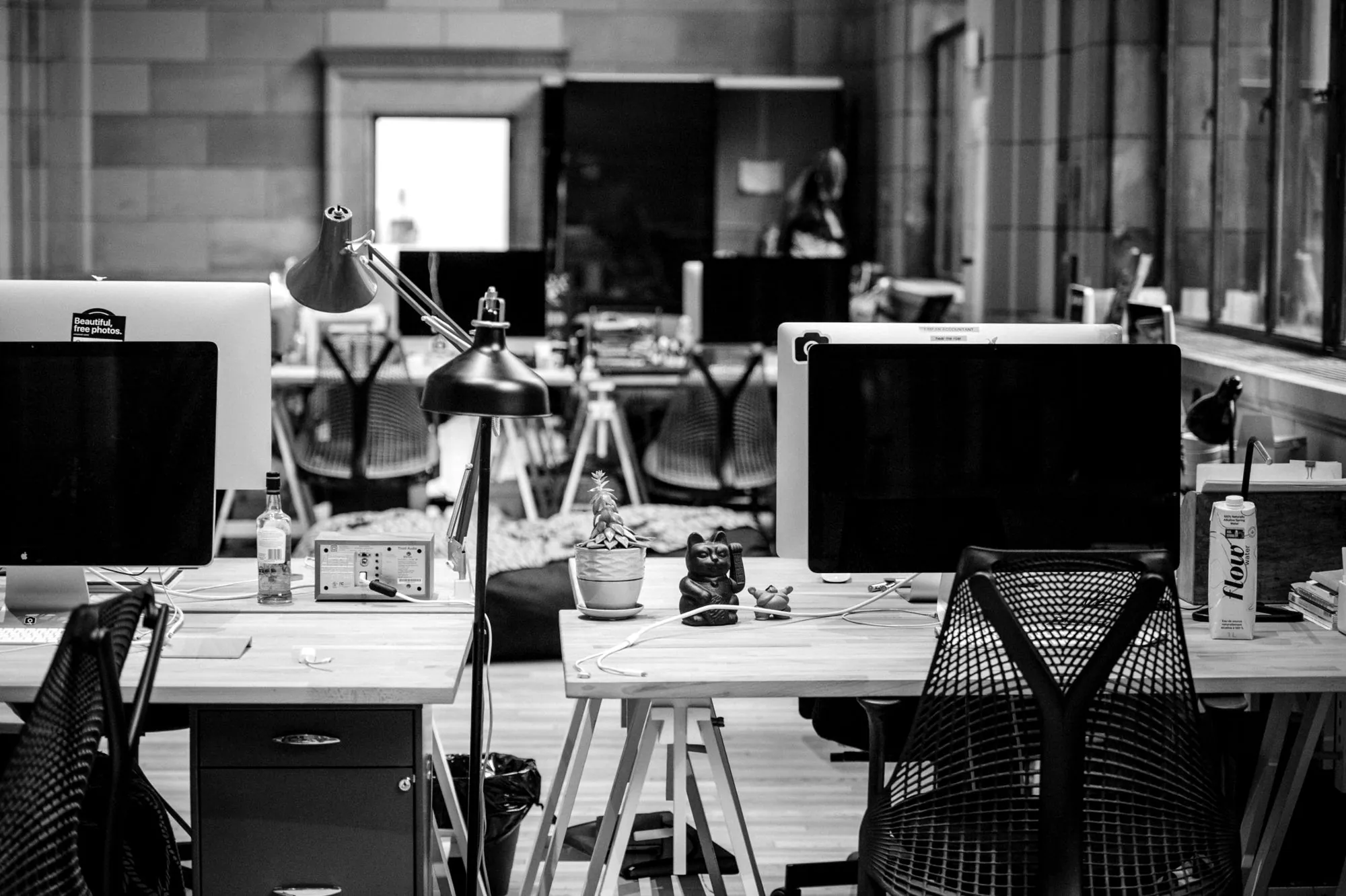 Rows of design desks and monitors in a quiet studio