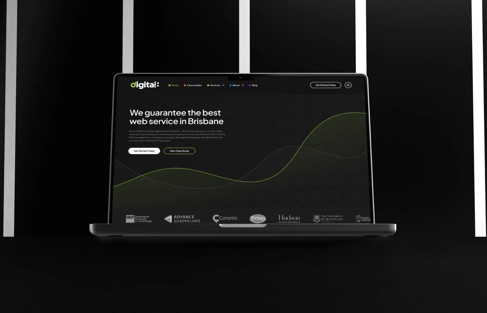 Digital8 homepage on a laptop in a dark room